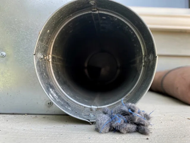 Granby Dryer Vent Cleaning technician using specialized equipment to clear severe dryer vent blockage in Granby